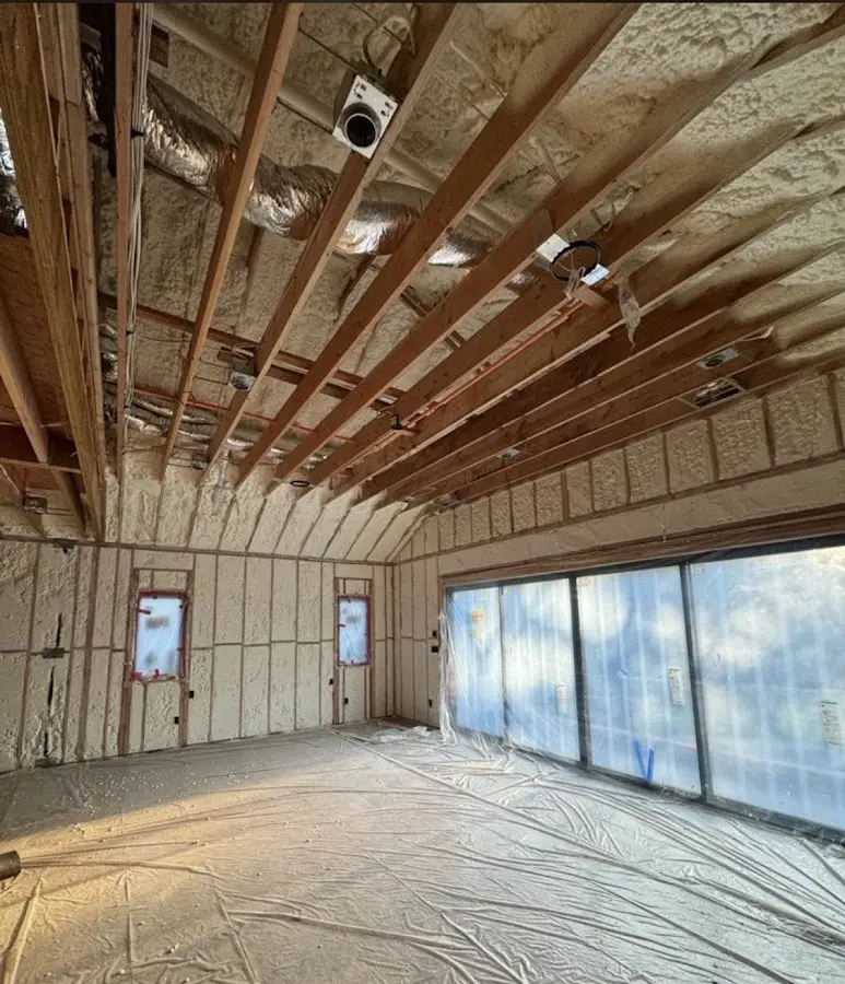 Interior walls and ceiling insulated with spray foam during new construction in Denver